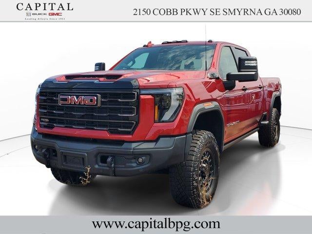 2026 GMC Sierra 2500 HD AT4X in Volcanic Red Tintcoat — front three-quarter view