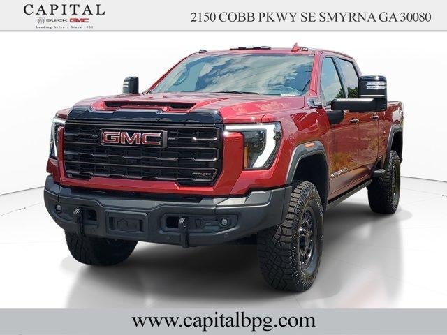 2026 GMC Sierra 2500 HD AT4X in Volcanic Red Tintcoat — front three-quarter view