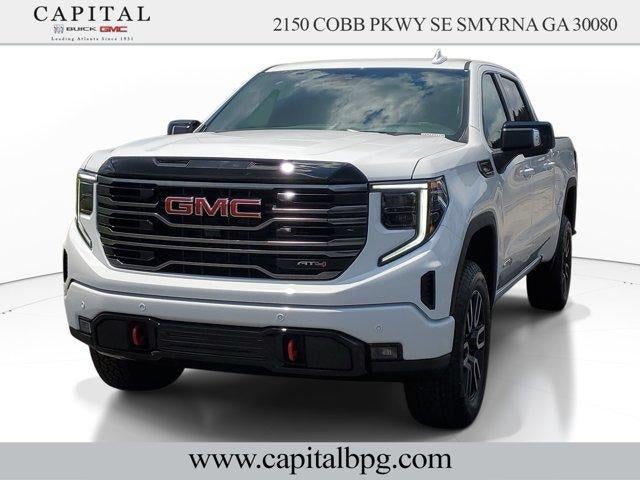 2026 GMC Sierra 1500 AT4 in Summit White — front three-quarter view