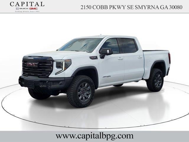 2026 GMC Sierra 1500 AT4X in Summit White — front three-quarter view