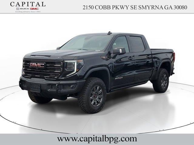 2026 GMC Sierra 1500 AT4X in Onyx Black — front three-quarter view