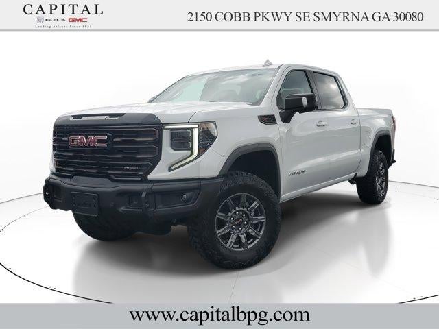 2026 GMC Sierra 1500 AT4X in Summit White — front three-quarter view