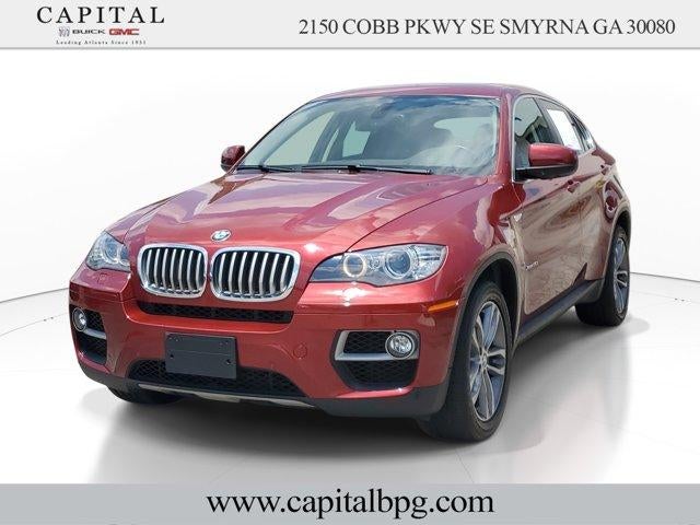 2013 BMW X6 xDrive50i in Red — front three-quarter view